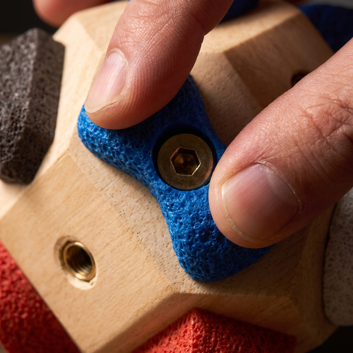 Wooden climbing block with swappable climbing holds